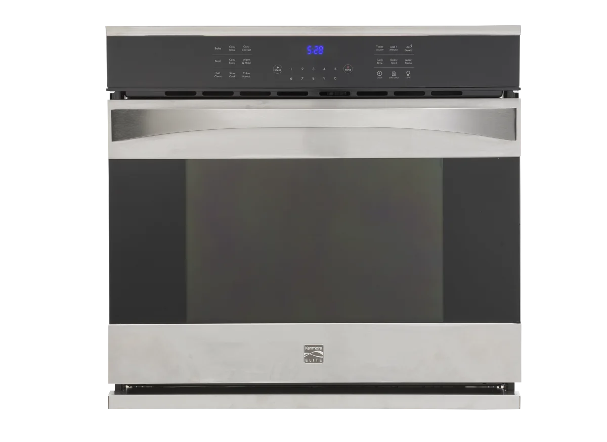 Built-in Kenmore Elite stainless steel wall oven cleanly fitted into custom kitchen cabinetry